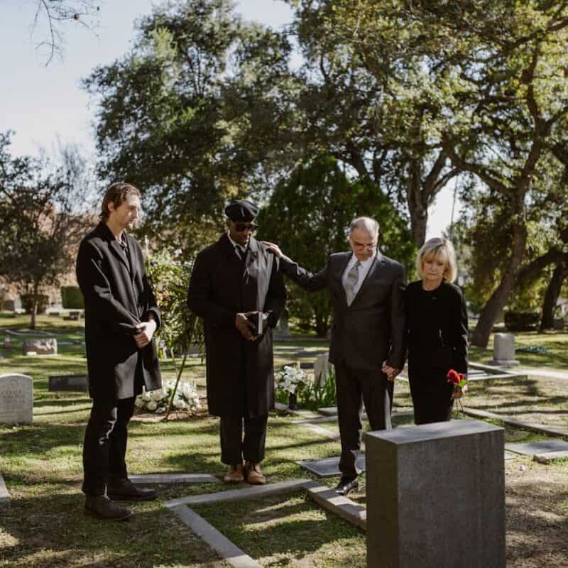 funeral attendees all dressed in black