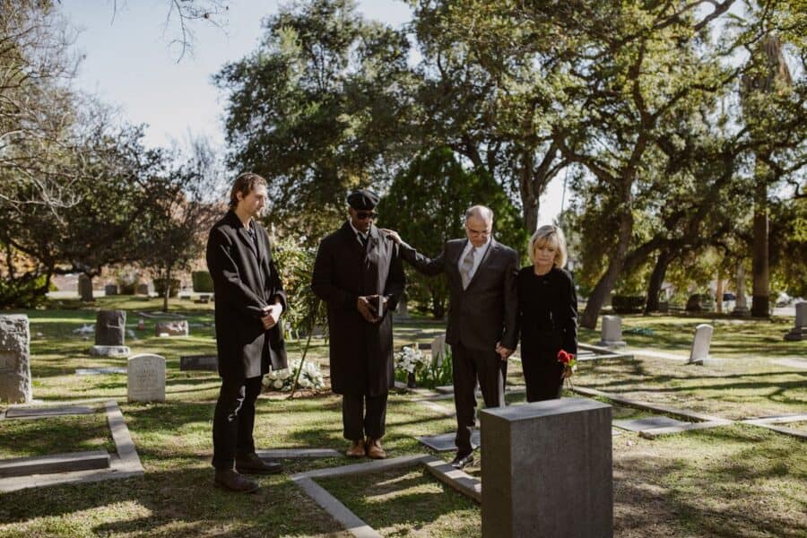 funeral attendees all dressed in black